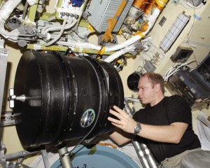 Expedition 22 Flight Engineer Oleg Kotov works with the Plasma Crystal-3 Plus experiment in the Zvezda service module of the International Space Station. Credit: NASA Expedition 22 Flight Engineer Oleg Kotov works with the Plasma Crystal-3 Plus experiment in the Zvezda service module of the International Space Station. Credit: NASA