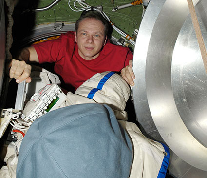 Cosmonaut Oleg Kotov works on a Russian Orlan spacesuit inside the Pirs Docking Compartment. Credit: NASA Cosmonaut Oleg Kotov works on a Russian Orlan spacesuit inside the Pirs Docking Compartment. Credit: NASA