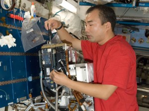 Flight Engineer Soichi Noguchi services the Fluid Physics Experiment Facility/Marangoni Surface Core hardware in the Kibo laboratory of the International Space Station. Credit: NASA Flight Engineer Soichi Noguchi services the Fluid Physics Experiment Facility/Marangoni Surface Core hardware in the Kibo laboratory of the International Space Station. Credit: NASA