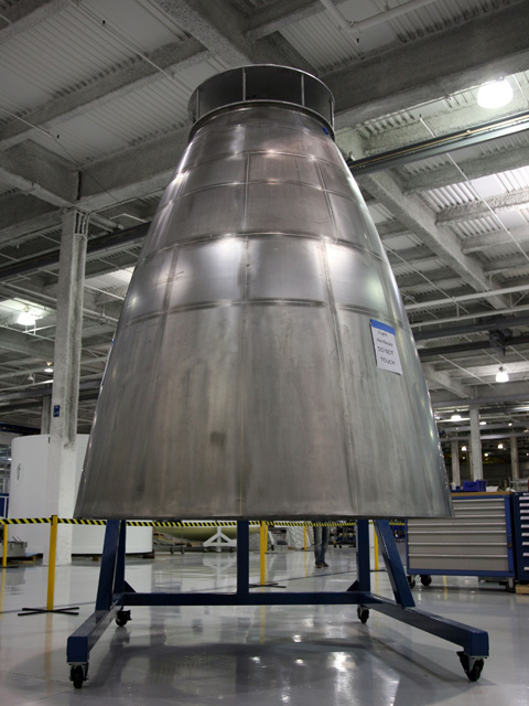 The Merlin Vacuum engine expansion nozzle measures 2.7 meters (9 feet) tall, and most of it has a wall thickness of about 1/3 of a millimeter (1/64 of an inch). Photo credit: SpaceX. The Merlin Vacuum engine expansion nozzle measures 2.7 meters (9 feet) tall, and most of it has a wall thickness of about 1/3 of a millimeter (1/64 of an inch). Photo credit: SpaceX.