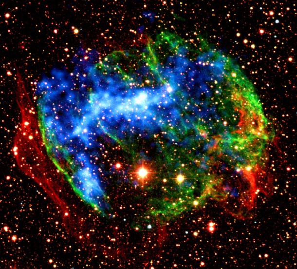 In the supernova remnant W49B, Suzaku found another fossil fireball. It detected X-rays produced when heavily ionized iron atoms recapture an electron. This view combines infrared images from the ground (red, green) with X-ray data from NASA's Chandra X-Ray Observatory (blue). Credit: Caltech/SSC/NASA In the supernova remnant W49B, Suzaku found another fossil fireball. It detected X-rays produced when heavily ionized iron atoms recapture an electron. This view combines infrared images from the ground (red, green) with X-ray data from NASA's Chandra X-Ray Observatory (blue). Credit: Caltech/SSC/NASA