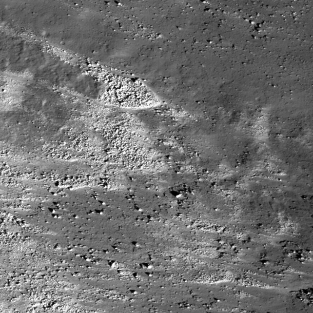 Eastern slope (right to left is downhill) of the Vallis Schröteri, "Cobra Head." This feature is located in the western portion of a Constellation Program region of interest on the Aristarchus Plateau. The slopes of the Cobra Head are boulder-rich and display reflectance variations, bright to dark. The patterns of debris and flows on the slopes are evidence for mass-wasting and landslides that expose a variety of rocks. The width of this image is 3.7 km (about 2.3 miles). Credit: NASA Eastern slope (right to left is downhill) of the Vallis Schröteri, "Cobra Head." This feature is located in the western portion of a Constellation Program region of interest on the Aristarchus Plateau. The slopes of the Cobra Head are boulder-rich and display reflectance variations, bright to dark. The patterns of debris and flows on the slopes are evidence for mass-wasting and landslides that expose a variety of rocks. The width of this image is 3.7 km (about 2.3 miles). Credit: NASA