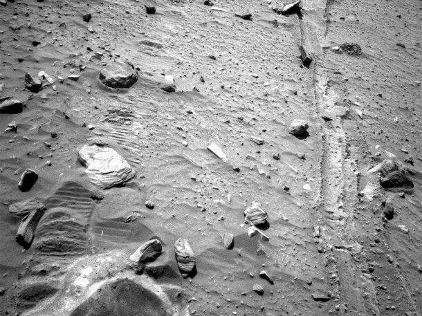 Spirit's last tracks. This view from Spirit's navigation camera shows tracks left by the rover as it drove backward, dragging its inoperable right-front wheel, to the location where the rover became trapped in soft sand in April 2009. Credit: NASA/JPL-Caltech Spirit's Tracks. Credit: NASA/JPL-Caltech