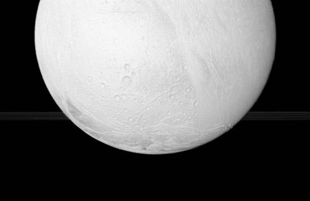 The Cassini spacecraft looks toward the south pole of Enceladus, with a glimpse of Saturn's rings in the distance. Credit: NASA/JPL The Cassini spacecraft looks toward the south pole of Enceladus, with a glimpse of Saturn's rings in the distance. Credit: NASA/JPL