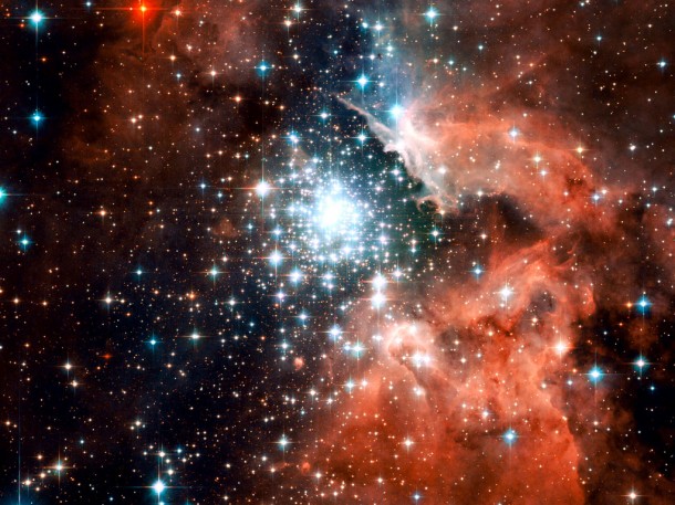 Extreme star cluster bursts into life. Credit: ESA/NASA