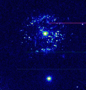 A Hubble Telescope image of T Pyxidis, taken in 1997. The blobs of light around the binary system are the leftovers from the recurring nova of the white dwarf in the system. Credit: NASA/ESA A Hubble Telescope image of T Pyxidis, taken in 1997. The blobs of light around the binary system are the leftovers from the recurring nova of the white dwarf in the system. Credit: NASA/ESA