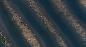 Dunes of sand-sized materials have been trapped on the floors of many Martian craters. This is one example, from a crater in Noachis Terra, west of the giant Hellas impact basin. Image Credit: NASA/JPL-Caltech/University of Arizona Dunes of sand-sized materials have been trapped on the floors of many Martian craters. This is one example, from a crater in Noachis Terra, west of the giant Hellas impact basin. Image Credit: NASA/JPL-Caltech/University of Arizona