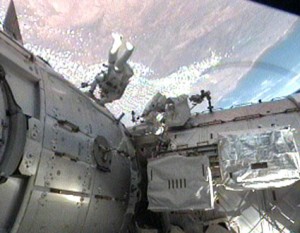 Mission Specialists Nicholas Patrick and Robert Behnken work outside the International Space Station during the second spacewalk of the STS-130 mission. Image credit: NASA TV Mission Specialists Nicholas Patrick and Robert Behnken work outside the International Space Station during the second spacewalk of the STS-130 mission. Image credit: NASA TV
