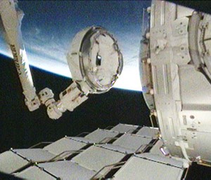 The cupola, attached to the station's robotic arm, is relocated to Tranquility's Earth-facing port. Image credit: NASA TV The cupola, attached to the station's robotic arm, is relocated to Tranquility's Earth-facing port. Image credit: NASA TV
