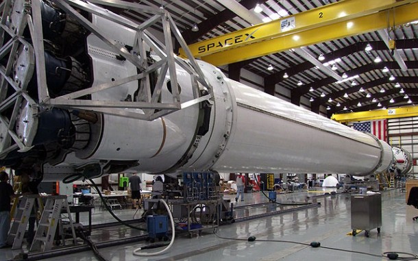 The Falcon 9 vehicle undergoes final integration in the hangar at the SpaceX launch site in Cape Canaveral, Florida. The vehicle's nine Merlin 1C engines are at far left, and second stage is at far right. Credit: SpaceX The Falcon 9 vehicle undergoes final integration in the hangar at the SpaceX launch site in Cape Canaveral, Florida. The vehicle's nine Merlin 1C engines are at far left, and second stage is at far right. Credit: SpaceX