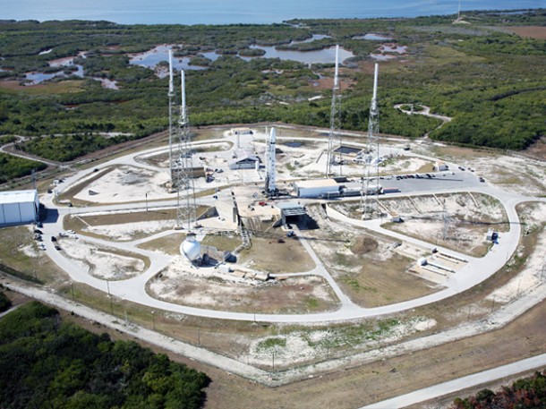 Aerial view of Falcon 9 with Dragon qualification spacecraft on the launch pad at SLC-40, Cape Canaveral, Florida. Credit: SpaceX. Aerial view of Falcon 9 with Dragon qualification spacecraft on the launch pad at SLC-40, Cape Canaveral, Florida. Credit: SpaceX.