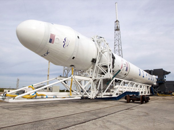 The full flight-ready Falcon 9 with Dragon qualification spacecraft rolls out of the SpaceX hangar at SLC-40, Cape Canaveral, Florida. Credit: SpaceX. The full flight-ready Falcon 9 with Dragon qualification spacecraft rolls out of the SpaceX hangar at SLC-40, Cape Canaveral, Florida. Credit: SpaceX.