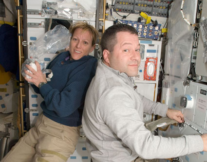 Mission Specialists Kathryn Hire and Nicholas Patrick are pictured on the middeck of space shuttle Endeavour while docked with the International Space Station. Image credit: NASA Mission Specialists Kathryn Hire and Nicholas Patrick are pictured on the middeck of space shuttle Endeavour while docked with the International Space Station. Image credit: NASA