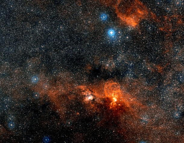 This wide-field image, based on data from Digitized Sky Survey 2, shows the whole region around the cosmic factory NGC 3603, located 22 000 light-years away. Credit: ESO/Digitized Sky Survey 2 This wide-field image, based on data from Digitized Sky Survey 2, shows the whole region around the cosmic factory NGC 3603, located 22 000 light-years away. Credit: ESO/Digitized Sky Survey 2