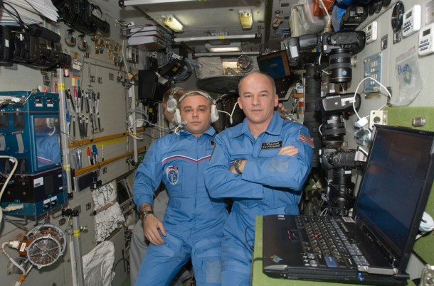 Expedition 22 Commander Jeff Williams (right) and Flight Engineers Maxim Suraev and Oleg Kotov (background) are pictured in the Zvezda service module of the International Space Station. Image Credit: NASA Expedition 22 Commander Jeff Williams (right) and Flight Engineers Maxim Suraev and Oleg Kotov (background) are pictured in the Zvezda service module of the International Space Station. Image Credit: NASA