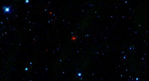 The red smudge at the center of this picture is the first comet discovered by NASA's Wide-Field Infrared Survey Explorer, or WISE. Image credit: NASA/JPL-Caltech/UCLA The red smudge at the center of this picture is the first comet discovered by NASA's Wide-Field Infrared Survey Explorer, or WISE. Image credit: NASA/JPL-Caltech/UCLA