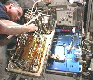 T.J. Creamer, Expedition 23 flight engineer, works on the Water Processing Assembly. Credit: NASA TV T.J. Creamer, Expedition 23 flight engineer, works on the Water Processing Assembly. Credit: NASA TV