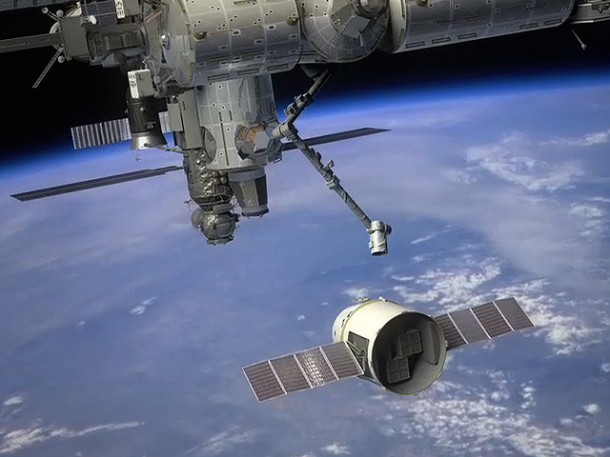Illustration of SpaceX's Dragon spacecraft arriving at the International Space Station. ISS astronauts will command Dragon via the SpaceX-developed communications hardware recently installed aboard the ISS. Credit: NASA Illustration of SpaceX's Dragon spacecraft arriving at the International Space Station. ISS astronauts will command Dragon via the SpaceX-developed communications hardware recently installed aboard the ISS. Credit: NASA
