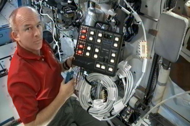 Astronaut Jeff Williams, Expedition 22 Commander, aboard the International Space Station with the SpaceX-developed controller for the Dragon spacecraft communications system. Credit: NASA Astronaut Jeff Williams, Expedition 22 Commander, aboard the International Space Station with the SpaceX-developed controller for the Dragon spacecraft communications system. Credit: NASA