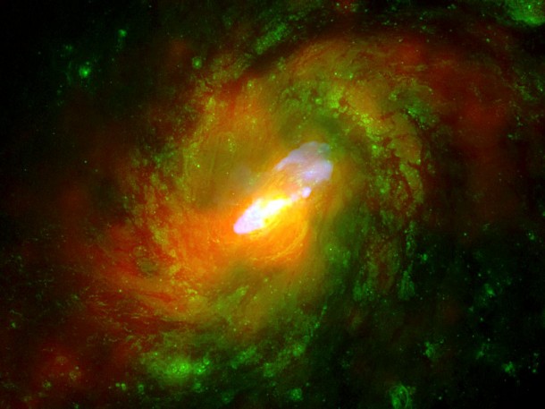 This is a composite image of NGC 1068, one of the nearest and brightest galaxies containing a rapidly growing supermassive black hole. Credit: X-ray (NASA/CXC/ MIT/C.Canizares, D.Evans et al), Optical (NASA/STScI), Radio (NSF/ NRAO/VLA) This is a composite image of NGC 1068, one of the nearest and brightest galaxies containing a rapidly growing supermassive black hole. Credit: X-ray (NASA/CXC/ MIT/C.Canizares, D.Evans et al), Optical (NASA/STScI), Radio (NSF/ NRAO/VLA)