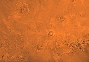 The Tharsis region of Mars, including the three volcanoes of Tharsis Montes (Arsia, Pavonis and Ascraeus Mons), as well as Olympic Mons in the upper left corner. Credit: NASA/Jet Propulsion Lab The Tharsis region of Mars, including the three volcanoes of Tharsis Montes (Arsia, Pavonis and Ascraeus Mons), as well as Olympic Mons in the upper left corner. Credit: NASA/Jet Propulsion Lab