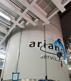 The fairing for Ariane 5’s dual-payload “stack” carries Arianespace’s logo and its “Service & Solutions” message tagline. The fairing for Ariane 5’s dual-payload “stack” carries Arianespace’s logo and its “Service & Solutions” message tagline.