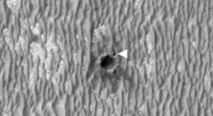 This image shows NASA's Mars Exploration Rover Opportunity perched on the edge of "Concepción" crater in Meridiani Planum, Mars. Image Credit: NASA/JPL-Caltech/University of Arizona This image shows NASA's Mars Exploration Rover Opportunity perched on the edge of "Concepción" crater in Meridiani Planum, Mars. Image Credit: NASA/JPL-Caltech/University of Arizona