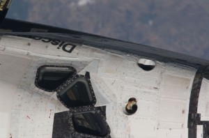 This nadir, 800mm view of the portside top part of Discovery's cabin was provided by one of the Expedition 23 crew members aboard the International Space Station. Image credit: NASA This nadir, 800mm view of the portside top part of Discovery's cabin was provided by one of the Expedition 23 crew members aboard the International Space Station. Image credit: NASA