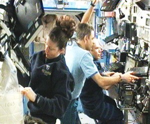 Expedition 23 Flight Engineers Tracy Caldwell Dyson (left) and Mikhail Kornienko (center), along with Commander Oleg Kotov, work in the International Space Station’s U.S. Destiny laboratory. Credit: NASA TV Expedition 23 Flight Engineers Tracy Caldwell Dyson (left) and Mikhail Kornienko (center), along with Commander Oleg Kotov, work in the International Space Station’s U.S. Destiny laboratory. Credit: NASA TV