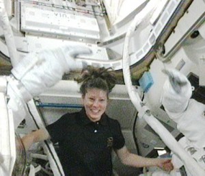 Expedition 23 Flight Engineer Tracy Caldwell Dyson assists STS-131 Mission Specialists Clay Anderson and Rick Mastracchio (both out of frame) inside the Quest airlock before the beginning of a spacewalk. Image Credit: NASA TV Expedition 23 Flight Engineer Tracy Caldwell Dyson assists STS-131 Mission Specialists Clay Anderson and Rick Mastracchio (both out of frame) inside the Quest airlock before the beginning of a spacewalk. Image Credit: NASA TV