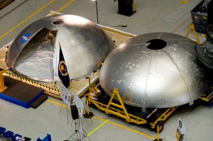 The left dome was created using the new manufacturing processes and eliminates at least seven major welds. A pie-shaped piece has been removed for material testing. Several weld demarcation lines are visible on the traditional fabricated tank dome on the right. (NASA/MSFC/David Higginbotham) The left dome was created using the new manufacturing processes and eliminates at least seven major welds. A pie-shaped piece has been removed for material testing. Several weld demarcation lines are visible on the traditional fabricated tank dome on the right. (NASA/MSFC/David Higginbotham)