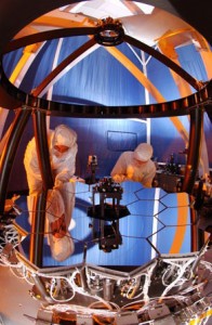Engineers at Ball Aerospace test the Wavefront Sensing and Control testbed to ensure that the 18 primary mirror segments and one secondary mirror on JWST work as one. The test is performed on a 1/6 scale model of the JWST mirrors. Credit: NASA/Northrop Grumman/Ball Aerospace Engineers at Ball Aerospace test the Wavefront Sensing and Control testbed to ensure that the 18 primary mirror segments and one secondary mirror on JWST work as one. The test is performed on a 1/6 scale model of the JWST mirrors. Credit: NASA/Northrop Grumman/Ball Aerospace