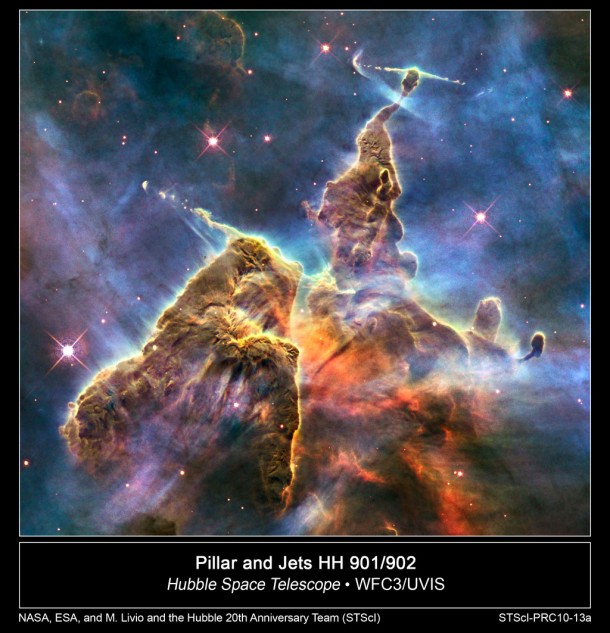 This brand new Hubble photo is of a small portion of one of the largest seen star-birth regions in the galaxy, the Carina Nebula. Towers of cool hydrogen laced with dust rise from the wall of the nebula. The scene is reminiscent of Hubble's classic "Pillars of Creation" photo from 1995, but is even more striking in appearance. The image captures the top of a three-light-year-tall pillar of gas and dust that is being eaten away by the brilliant light from nearby bright stars. The pillar is also being pushed apart from within, as infant stars buried inside it fire off jets of gas that can be seen streaming from towering peaks like arrows sailing through the air. Credit: NASA, ESA, and M. Livio and the Hubble 20th Anniversary Team (STScI) This brand new Hubble photo is of a small portion of one of the largest seen star-birth regions in the galaxy, the Carina Nebula. Towers of cool hydrogen laced with dust rise from the wall of the nebula. The scene is reminiscent of Hubble's classic "Pillars of Creation" photo from 1995, but is even more striking in appearance. The image captures the top of a three-light-year-tall pillar of gas and dust that is being eaten away by the brilliant light from nearby bright stars. The pillar is also being pushed apart from within, as infant stars buried inside it fire off jets of gas that can be seen streaming from towering peaks like arrows sailing through the air. Credit: NASA, ESA, and M. Livio and the Hubble 20th Anniversary Team (STScI)