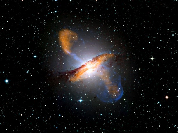 Colour composite image of Centaurus A, revealing the lobes and jets emanating from the active galaxy’s central black hole. Credit: ESO/WFI (Optical); MPIfR/ESO/APEX/A.Weiss et al. (Submillimetre); NASA/CXC/CfA/R.Kraft et al. (X-ray) Colour composite image of Centaurus A, revealing the lobes and jets emanating from the active galaxy’s central black hole. Credit: ESO/WFI (Optical); MPIfR/ESO/APEX/A.Weiss et al. (Submillimetre); NASA/CXC/CfA/R.Kraft et al. (X-ray)