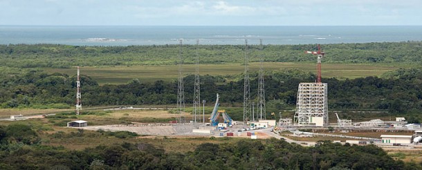 This panoramic photo provides an overview of the Soyuz launch zone. In the center is the launch pad with its umbilical masts and support arms for the Soyuz vehicle, surrounded by four tall lightning protection towers. To the right is the mobile gantry, while the French Guiana coastline with the Atlantic Ocean is visible in the background. This panoramic photo provides an overview of the Soyuz launch zone. In the center is the launch pad with its umbilical masts and support arms for the Soyuz vehicle, surrounded by four tall lightning protection towers. To the right is the mobile gantry, while the French Guiana coastline with the Atlantic Ocean is visible in the background.