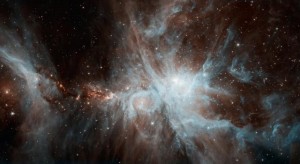 A colony of hot, young stars is stirring up the cosmic scene in this new picture from NASA's Spitzer Space Telescope. Image credit: NASA/JPL-Caltech A colony of hot, young stars is stirring up the cosmic scene in this new picture from NASA's Spitzer Space Telescope. Image credit: NASA/JPL-Caltech