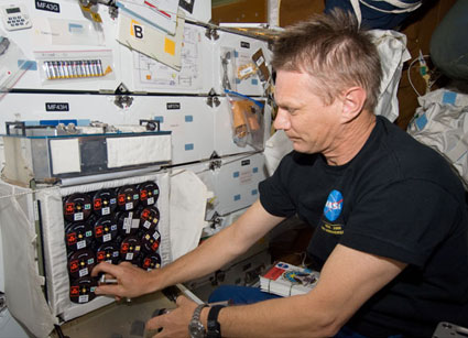 NASA astronaut Piers Sellers, STS-132 mission specialist, works with Group Activation Packs on the middeck of space shuttle Atlantis. Credit: NASA NASA astronaut Piers Sellers, STS-132 mission specialist, works with Group Activation Packs on the middeck of space shuttle Atlantis. Credit: NASA