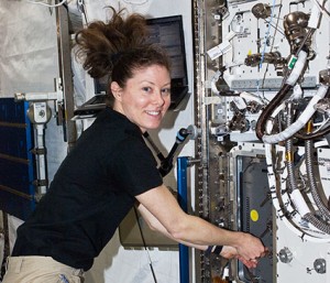 Flight Engineer Tracy Caldwell Dyson works on hardware inside the Kibo laboratory. Credit: NASA TV  