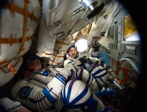 Attired in their Russian Sokol launch and entry suits, Commander Oleg Kotov (left) and Flight Engineer Soichi Noguchi conduct a standard suit leak check in the Soyuz TMA-17 spacecraft in preparation for the relocation of the Soyuz. Credit: NASA Attired in their Russian Sokol launch and entry suits, Commander Oleg Kotov (left) and Flight Engineer Soichi Noguchi conduct a standard suit leak check in the Soyuz TMA-17 spacecraft in preparation for the relocation of the Soyuz. Credit: NASA