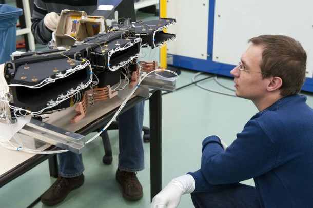 Engineering model of Proba-V's imager - known as the Structural and Thermal Model (STM) - being prepared for testing by OIP engineers Jorg Versluys and Nico Van Vooren in ESA's Mechanical Systems Laboratory on 15 March 2010. Thermocouples have been added to the STM in advance of it being placed inside a vacuum chamber where it would be subjected to space-like hard vacuum and temperature extremes. Credits: ESA Engineering model of Proba-V's imager - known as the Structural and Thermal Model (STM) - being prepared for testing by OIP engineers Jorg Versluys and Nico Van Vooren in ESA's Mechanical Systems Laboratory on 15 March 2010. Thermocouples have been added to the STM in advance of it being placed inside a vacuum chamber where it would be subjected to space-like hard vacuum and temperature extremes. Credits: ESA