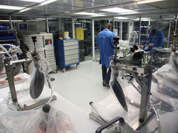 Technicians produce Draco thrusters in the SpaceX Hawthorne propulsion clean room. With up to 18 Dracos per Dragon, and with 17 Dragon missions currently on our launch manifest, we are manufacturing many thrusters per month. Credit: SpaceX. Technicians produce Draco thrusters in the SpaceX Hawthorne propulsion clean room. With up to 18 Dracos per Dragon, and with 17 Dragon missions currently on our launch manifest, we are manufacturing many thrusters per month. Credit: SpaceX.