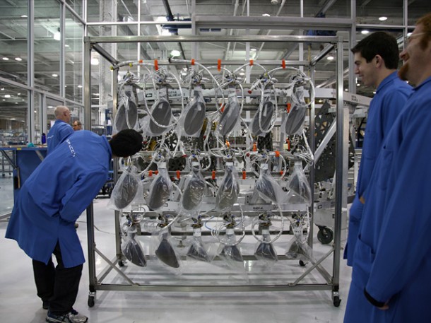 Inspecting the first 18 flight Draco thrusters prior to their installation into the “COTS 1” Dragon spacecraft, scheduled to fly on Falcon 9 Flight 2. Credit: SpaceX. Inspecting the first 18 flight Draco thrusters prior to their installation into the “COTS 1” Dragon spacecraft, scheduled to fly on Falcon 9 Flight 2. Credit: SpaceX.