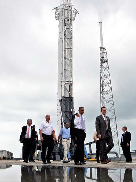 President Barack Obama and SpaceX CEO and CTO Elon Musk at the SpaceX Falcon 9 launch pad, Cape Canaveral, Florida on April 15, 2010. SpaceX's Leslie Woods Jr. and NASA Administrator Charles Bolden in background. Credit: Associated Press. President Barack Obama and SpaceX CEO and CTO Elon Musk at the SpaceX Falcon 9 launch pad, Cape Canaveral, Florida on April 15, 2010. SpaceX's Leslie Woods Jr. and NASA Administrator Charles Bolden in background. Credit: Associated Press.
