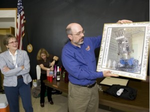Solar Dynamics Observatory project scientist Dean Pesnell presents former project manager Liz Citrin with a signed photo of the SDO spacecraft that team members signed during an informal reception held after the successful handover meeting. Credit: Bill Hrybyk, NASA GSFC Solar Dynamics Observatory project scientist Dean Pesnell presents former project manager Liz Citrin with a signed photo of the SDO spacecraft that team members signed during an informal reception held after the successful handover meeting. Credit: Bill Hrybyk, NASA GSFC