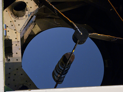 Faint specks of starlight are reflected by the 100-inch (2.5 meter) primary mirror on NASA's Stratospheric Observatory for Infrared Astronomy (SOFIA) during ground testing of the Faint Object Infrared Camera for the SOFIA Telescope (FORCAST). (NASA/Tom Tschida) Faint specks of starlight are reflected by the 100-inch (2.5 meter) primary mirror on NASA's Stratospheric Observatory for Infrared Astronomy (SOFIA) during ground testing of the Faint Object Infrared Camera for the SOFIA Telescope (FORCAST). (NASA/Tom Tschida)