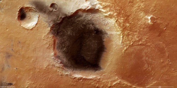 Meridiani Planum, at the northern edge of the southern highlands of Mars, lies between the volcanic Tharsis Region to the west and the low-lying Hellas Planitia impact basin to the south-east. Credits: ESA/DLR/FU Berlin (G. Neukum) Meridiani Planum, at the northern edge of the southern highlands of Mars, lies between the volcanic Tharsis Region to the west and the low-lying Hellas Planitia impact basin to the south-east. Credits: ESA/DLR/FU Berlin (G. Neukum)