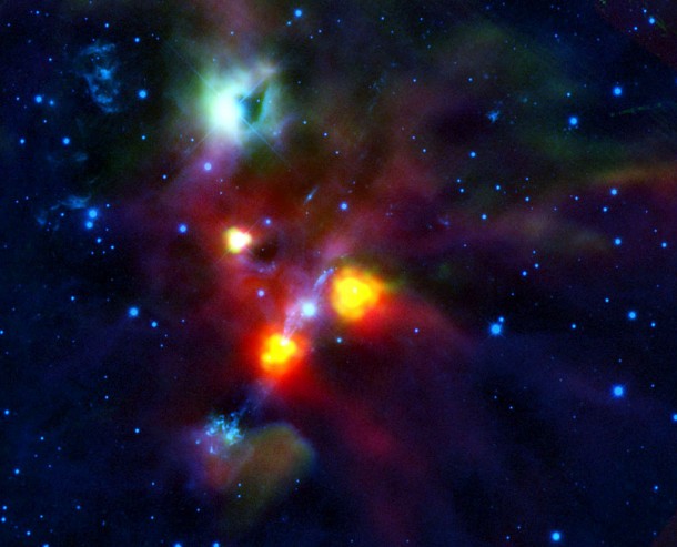 NGC 1999 is the green tinged cloud towards the top of the image. The dark spot to the right was thought to be a cloud of dense dust and gas until Herschel looked at it. It is in fact a hole that has been blown in the side of NGC 1999 by the jets and winds of gas from the young stellar objects in this region of space. Credits: ESA/HOPS Consortium NGC 1999 is the green tinged cloud towards the top of the image. The dark spot to the right was thought to be a cloud of dense dust and gas until Herschel looked at it. It is in fact a hole that has been blown in the side of NGC 1999 by the jets and winds of gas from the young stellar objects in this region of space. Credits: ESA/HOPS Consortium