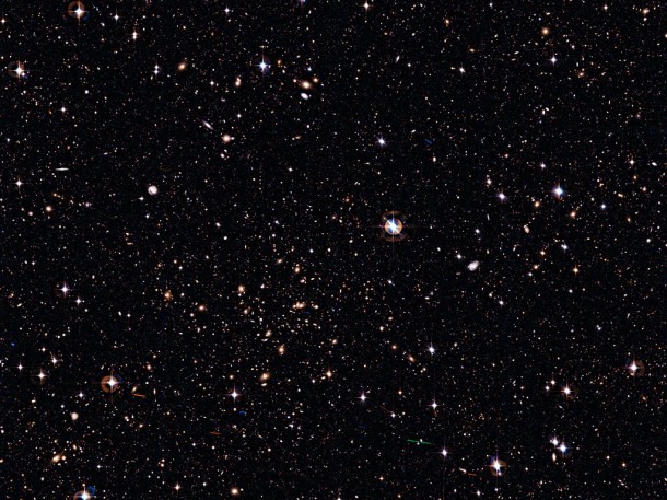 This wide-field, deep image reveals thousands of galaxies crowding an area on the sky roughly as large as the full Moon. These galaxies span a vast range of distances from us. Some are relatively close, as it is possible to distinguish their spiral arms or elliptical halos, especially in the upper part of the image. Credit: ESO/J. Dietrich This wide-field, deep image reveals thousands of galaxies crowding an area on the sky roughly as large as the full Moon. These galaxies span a vast range of distances from us. Some are relatively close, as it is possible to distinguish their spiral arms or elliptical halos, especially in the upper part of the image. Credit: ESO/J. Dietrich
