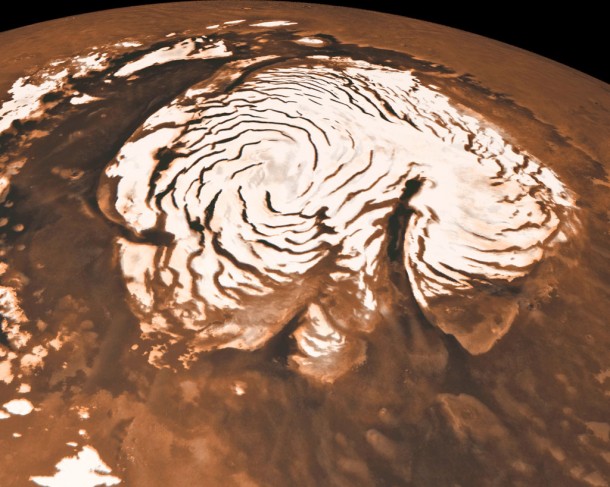 The origin of the spiral troughs and the giant canyon (called "Chasma Borale") in the north polar ice cap on Mars have finally been explained after four decades of uncertainty. The origin of the spiral troughs and the giant canyon (called "Chasma Borale") in the north polar ice cap on Mars have finally been explained after four decades of uncertainty.