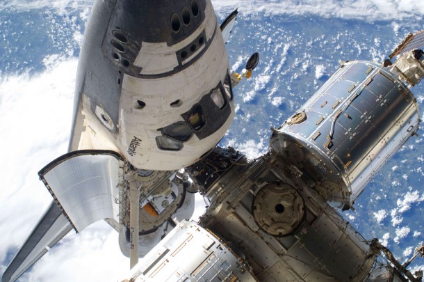This image features the space shuttle Atlantis's cabin and forward cargo bay and part of the International Space Station while the two spacecraft remain docked. Image credit: NASA This image features the space shuttle Atlantis's cabin and forward cargo bay and part of the International Space Station while the two spacecraft remain docked. Image credit: NASA